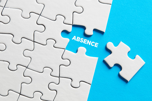 Picture of a jigsaw puzzle with a piece missing exposing the word absence.