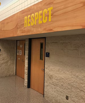 Picture of the Pillar of Character  sign above a classroom entrance